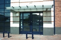 pair of aluminium swing doors complete with fixed glazed side screens, constructed of blue aluminium